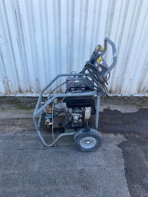 a small machine that is sitting on the side of the road
