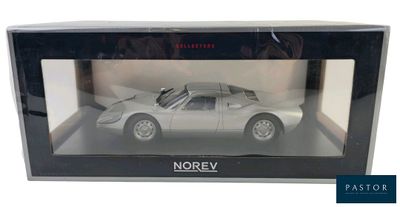 a silver model of a car in a box