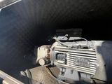 a motor that is sitting in the back of a truck