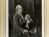 an old black and white photograph of a man holding a child