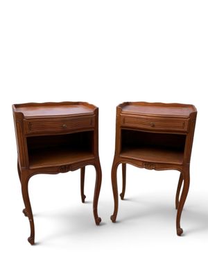 pair of nightstand tables with drawers on each side of each other