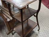 a wooden table with two chairs on it