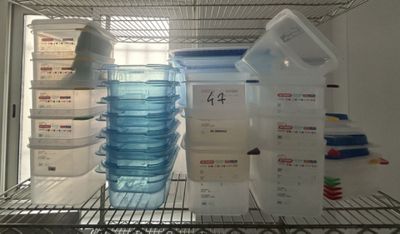 a refrigerator with a lot of containers and containers inside of it