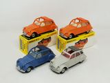 three small toy cars are sitting on top of a box