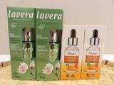 three bottles of laveraa products sitting on top of a wooden tray