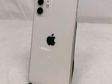 an apple iphone is sitting on a stand on a white surface