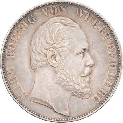 Gros plan sur une pièce de monnaie portant le visage d'un homme