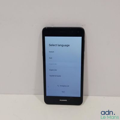 the phone is sitting on the table with the screen showing the language