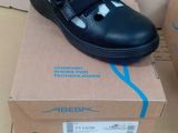a pair of shoes that are on top of a box