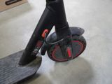 a scooter that is sitting on the floor in a room