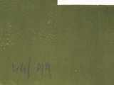 a green piece of paper with writing on it