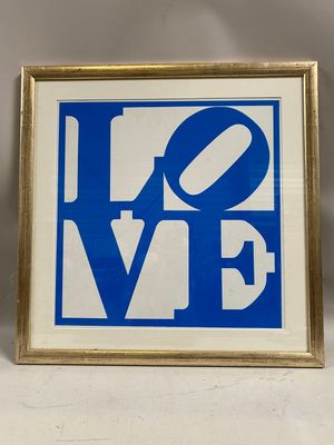 a framed picture of a blue and white love sign