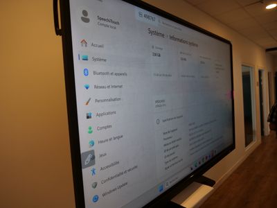 a large flat screen tv on the wall in the room
