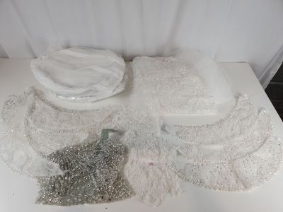 a white table with a lot of white items on it