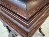 a close up of a table with a clock on top of it