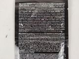a close up of a package of toothpaste on a white surface