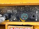 a close up of a warning sign on the back of a construction vehicle