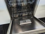 a dishwasher in the middle of a kitchen