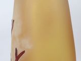 a glass vase with a yellow liquid inside of it