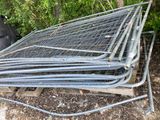 a pile of metal pipes sitting on top of a pile of wood