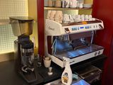 a coffee machine sitting on a counter in a kitchen