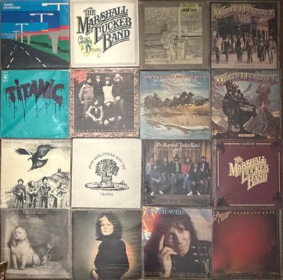 a picture of a wall full of albums and cds