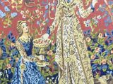 tapestry of a lady and a child in a garden with flowers