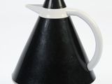 a black and white pitcher with a white handle
