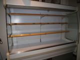 an empty display case in the middle of a room
