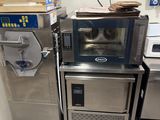 a small kitchen with a microwave and other appliances in it