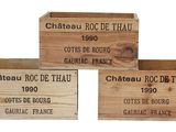 three wooden boxes with different types of wine in them