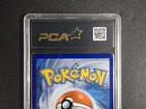 a close up of a pokemon card in a plastic case