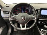 the interior of a car with a steering wheel and dashboard controls