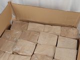 a cardboard box full of soap bars on a table