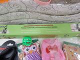 a pile of items that include a pair of scissors, a pair of socks, a pair of flip flops, and a pair of flip flop flop