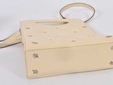 cream leather handbag with stars and stars on the side