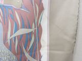 a picture of a woman with a peacock on a pillow