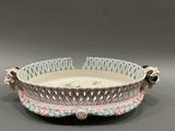 an image of a white and pink bowl sitting on top of a table