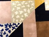 a close up of a patch of fabric with different colors