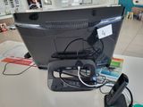 an image of a desk with a computer monitor and a cell phone