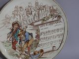a plate with a picture of a man and a woman on it