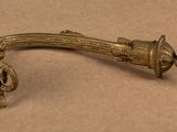 a small brass object that is on a table