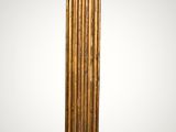 an image of a tall gold column with a clock on top of it