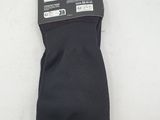 the back of a pair of black socks on a white surface