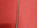 a close up of a knife and fork on a red surface