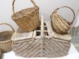 several wicker baskets are stacked on top of each other on a table