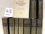 six books are stacked on top of each other on a table