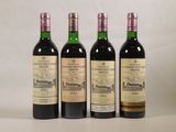 trois bouteilles de vin posées l'une à côté de l'autre sur une table