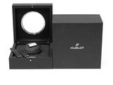 the watch is in a black box with a mirror in it