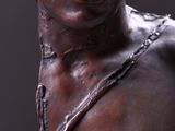 a close up of a bronze statue of a man with a beard